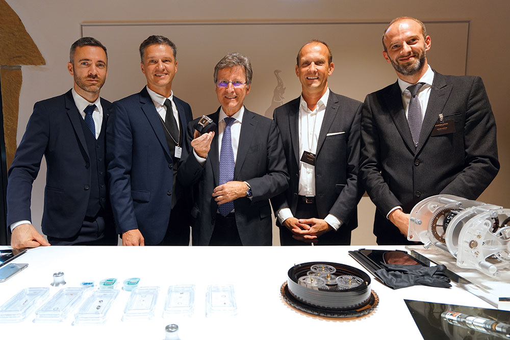 Michael Parmigiani (center) and the Parmigiani Fleurier team