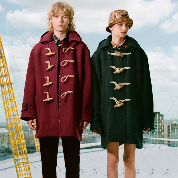 Models are both wearing the Gosha x Burberry Oversized Duffle Coat, in Claret and Dark Forest Green