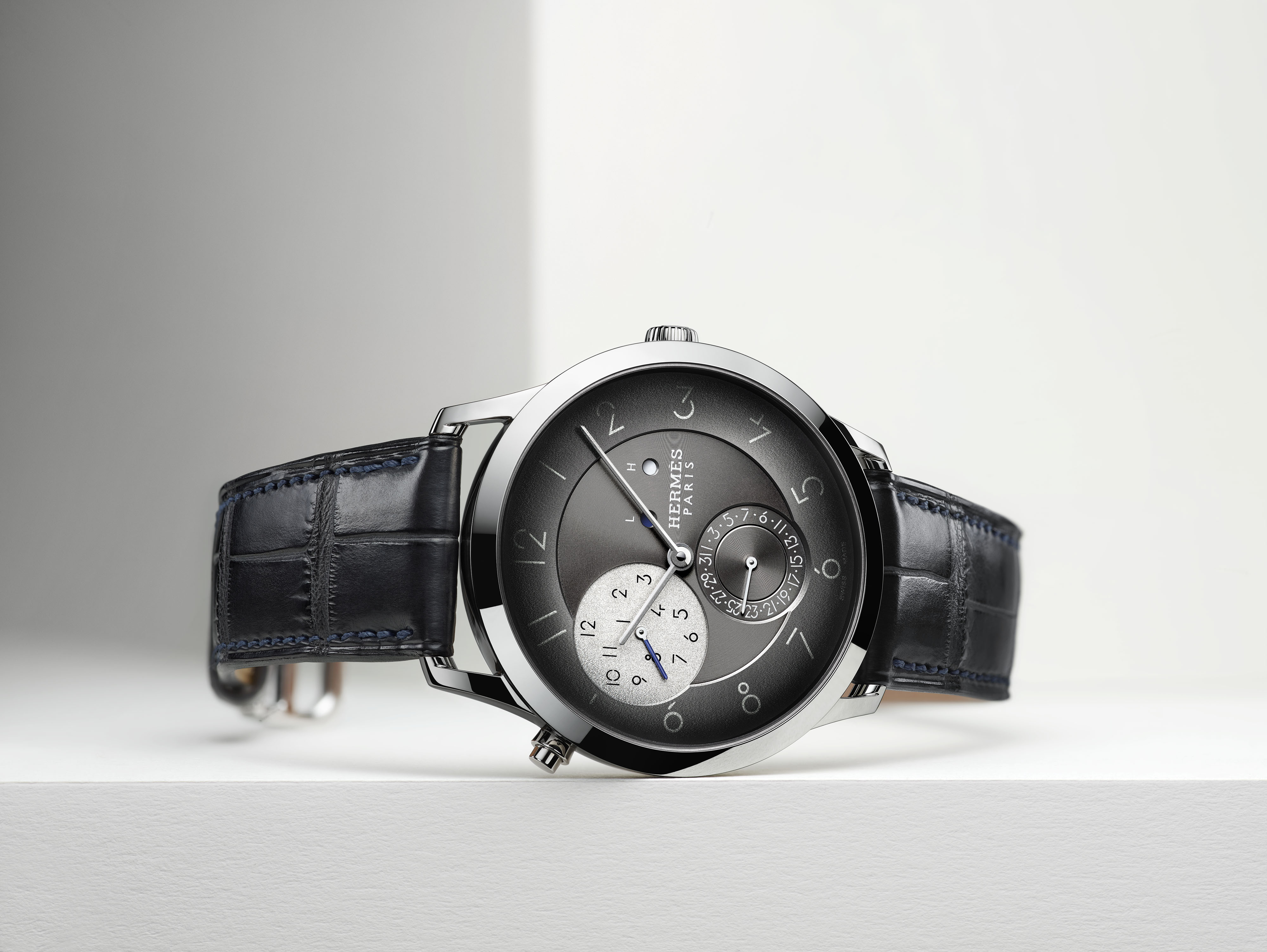 Each Slim d’Hermès GMT is crafted with palladium and an alligator strap