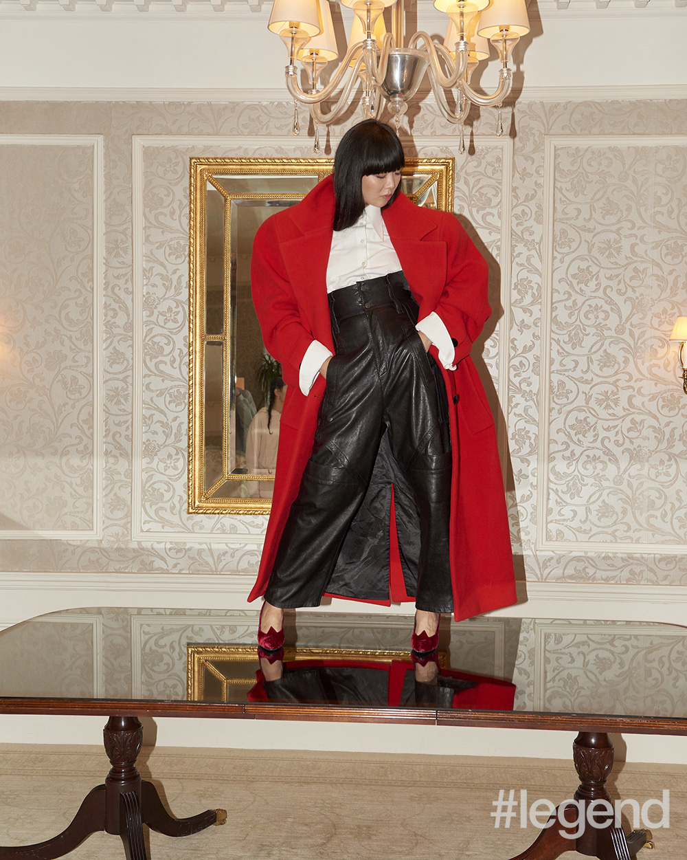 Red coat, white cotton shirt, black leather trousers and red velvet pumps by Marc Jacobs shot in the Charles Pierre Suite at The Pierre