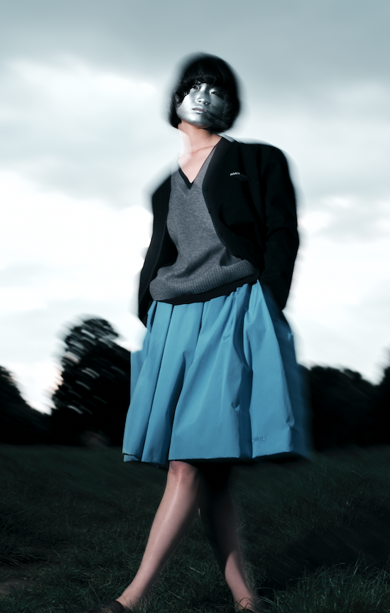 Black jumper, grey pullover, blue skirt and black loafers _ Miu Miu