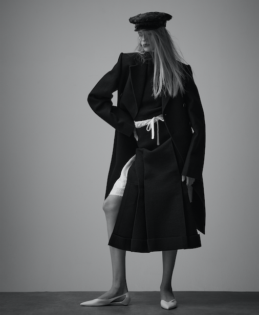 Feather hat, coat, rollneck jumper, skirt, underskirt and flats _ Prada