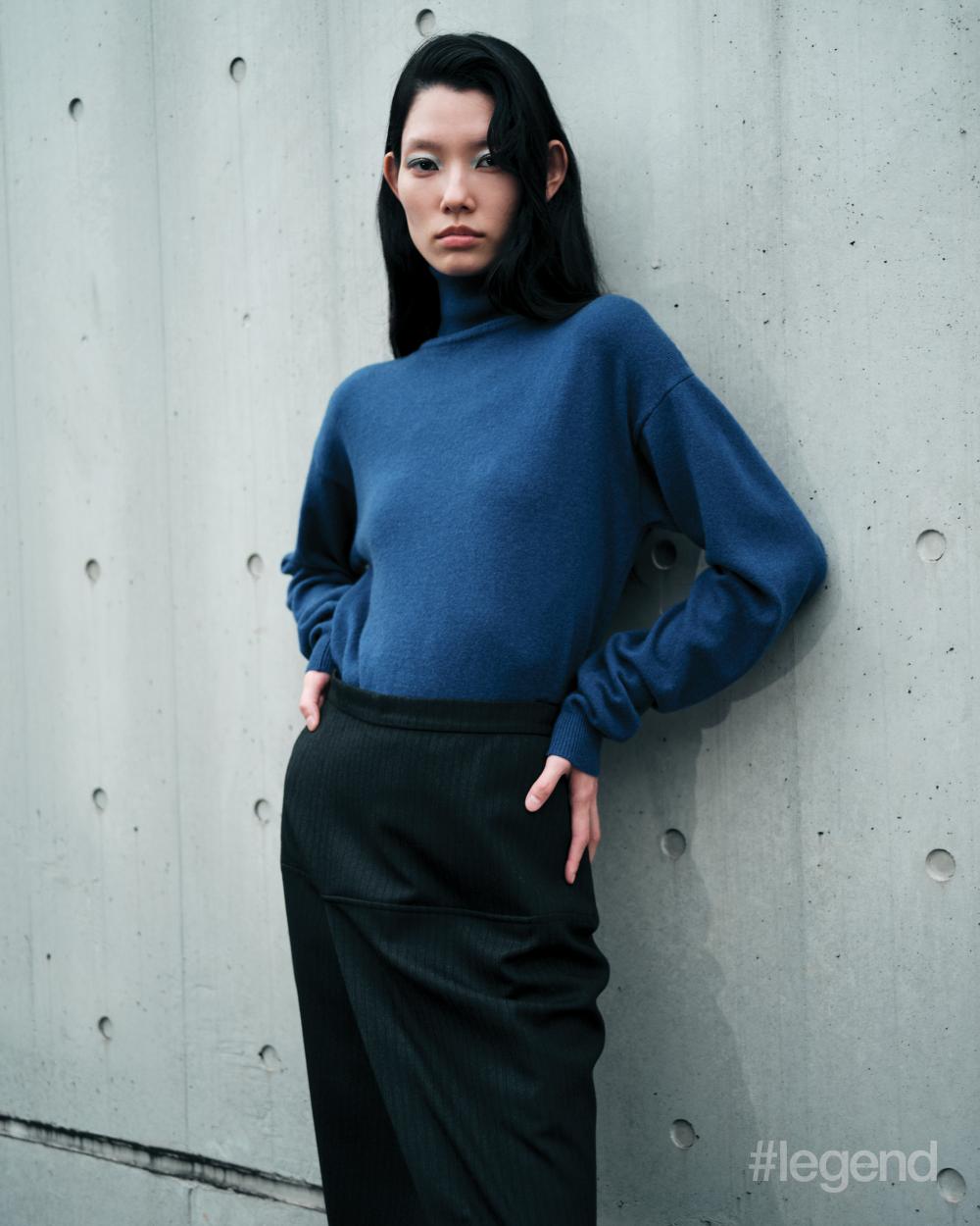 Blue turtleneck _ Saint Laurent; Black skirt _ Fendi