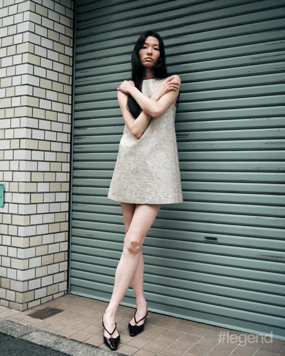 Beige sleeveless dress _ Celine by Hedi Slimane; Black sandals _ Fendi