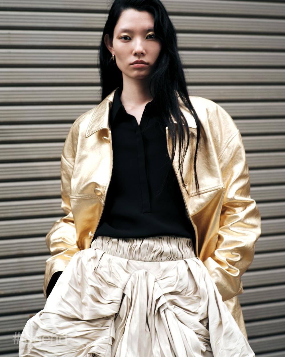 Metallic leather jacket _ Coach; Black polo shirt _ Fendi; Beige skirt _ Louis Vuitton