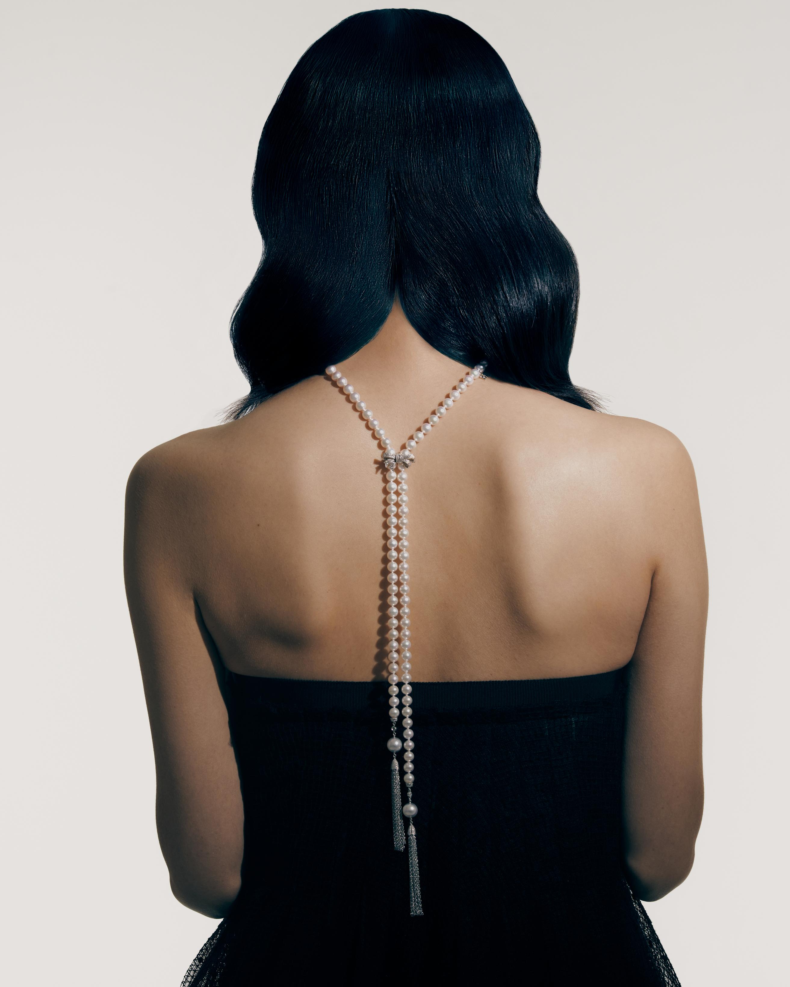 Skipping Rope necklace in white gold with Akoya and South Sea cultured pearls and diamonds, and Jeux de Rubans necklace shortener in white gold with diamonds _ Mikimoto; Black skirt (worn as dress) _ Dior