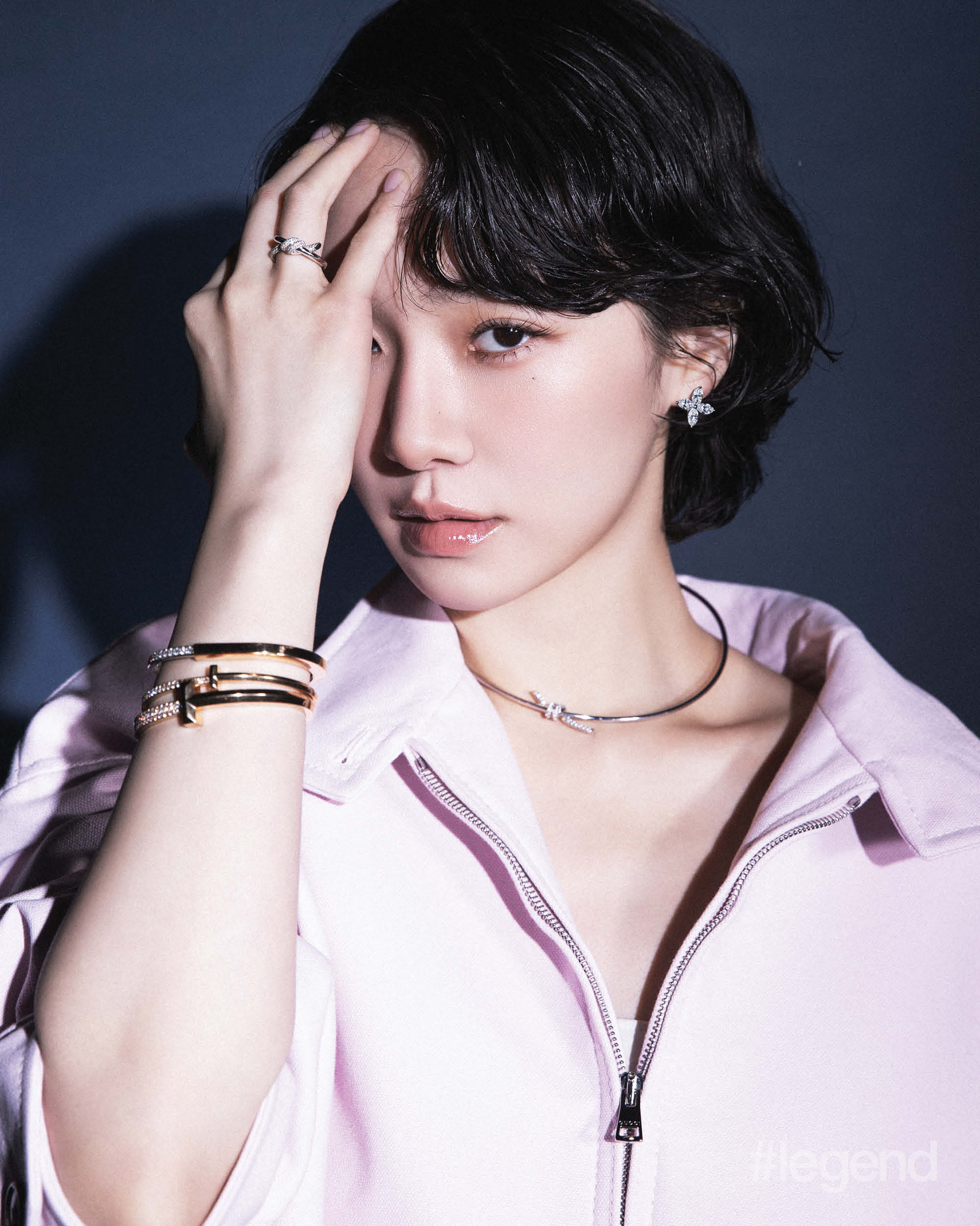 Tiffany Victoria® earrings in platinum with diamonds, Tiffany Knot necklace and double row ring in white gold with diamonds, Tiffany Lock bangle in rose gold with diamonds, and Tiffany T T1 bangles in rose gold with diamonds _ Tiffany & Co.; Pink cotton canvas bomber jacket and midi skirt _ Gucci