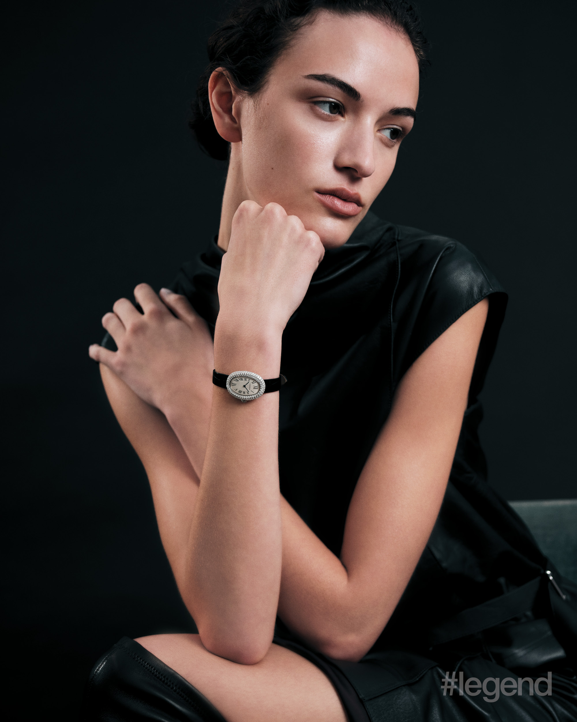 Baignoire watch in white gold with diamonds _ Cartier; Black leather dress _ Tod’s; Black leather boots _ Balenciaga