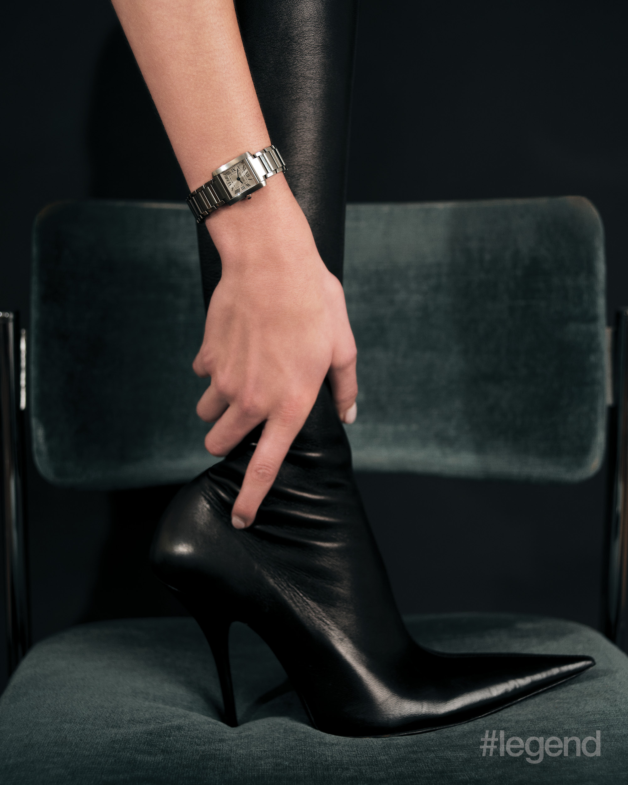 Tank Française watch in steel _ Cartier; Black leather boots _ Balenciaga