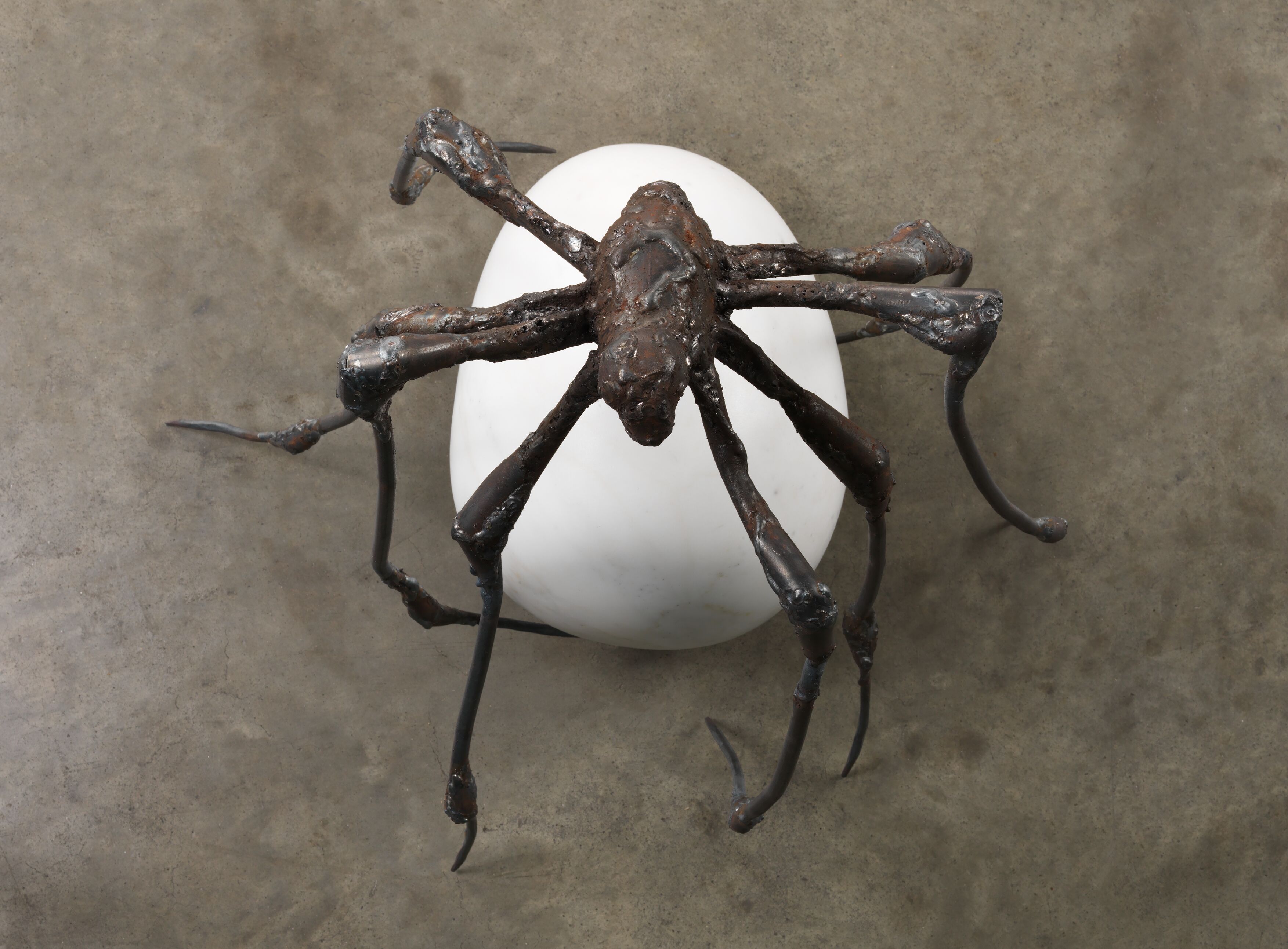 Spider, 2000, steel and marble.