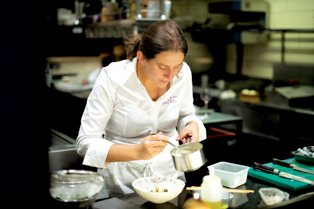 Chef Adeline Grattard plates a dish in her Parisian restaurant