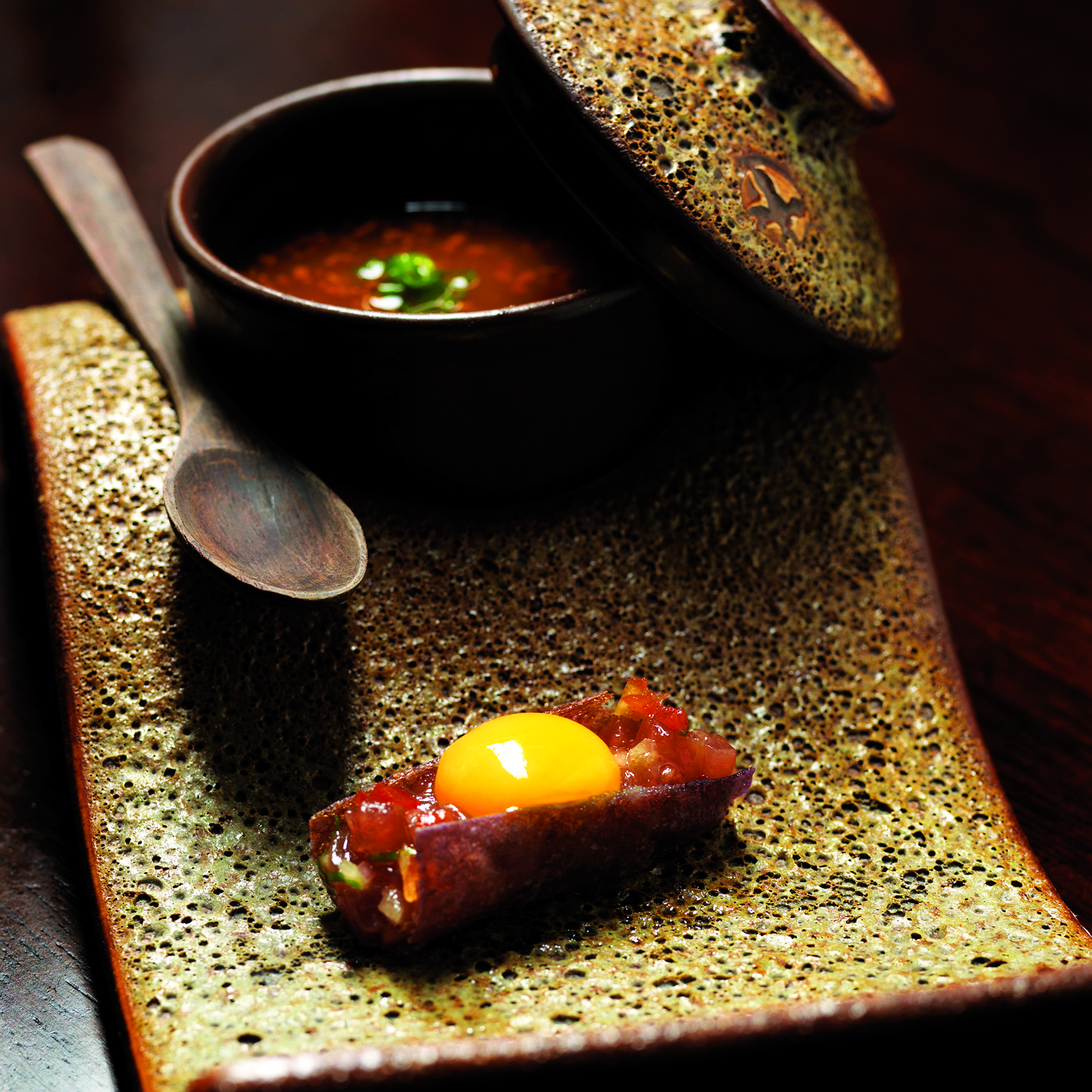 Bonito Porcon Umami features raw Bonito, Porcon mushroom chawanmushi and a potato cracker topped with a quail's egg