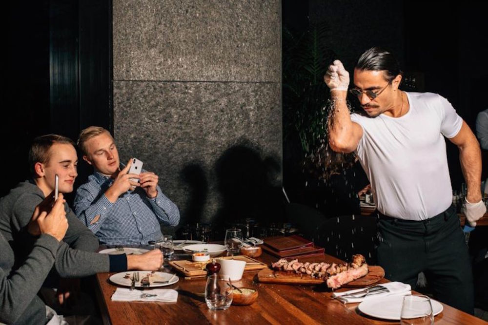Nusret Gökçe performing his salting ritual in the New York steakhouse (picture: New York Times)