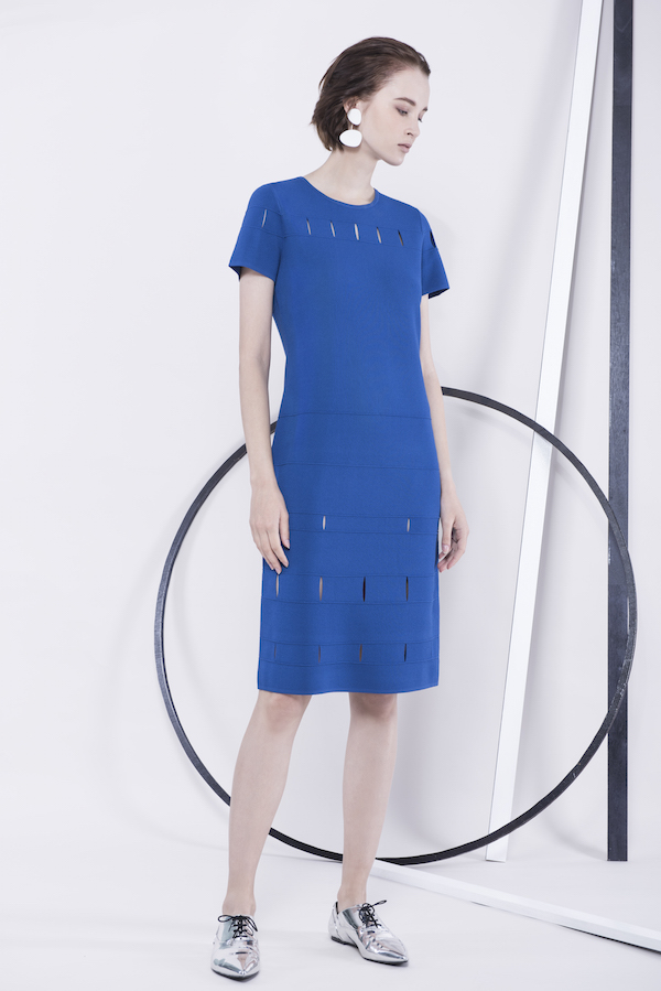 Slashes create a subtle peek-a-boo pattern in this electric blue shift dress