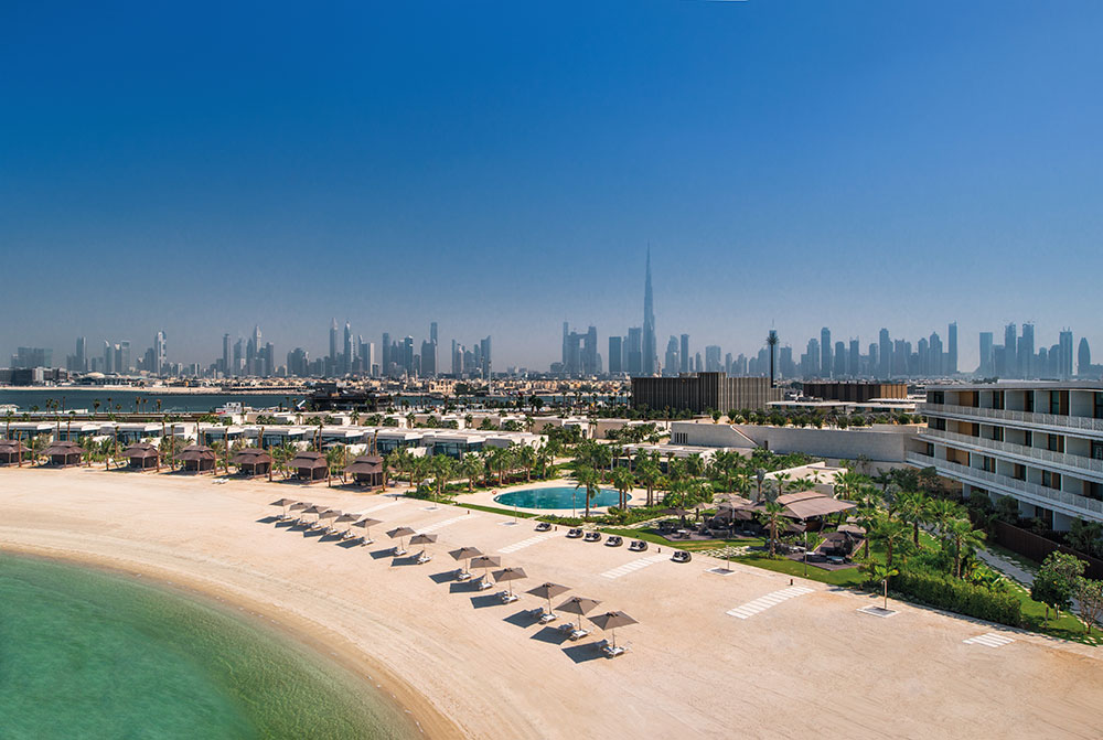The hotel beach with Dubai's skyline behind it