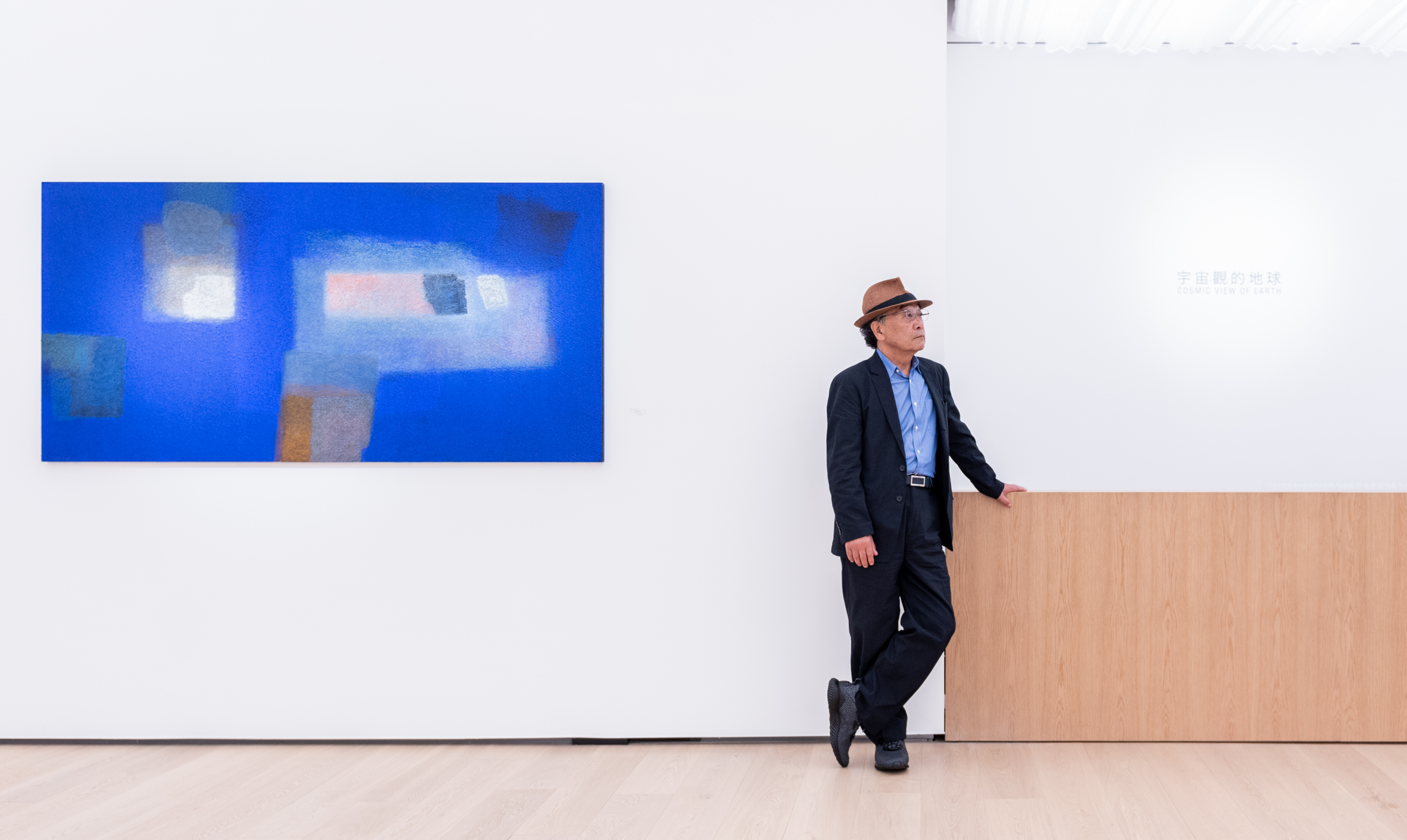 Katsuyoshi Inokuma stands next to his work titled 