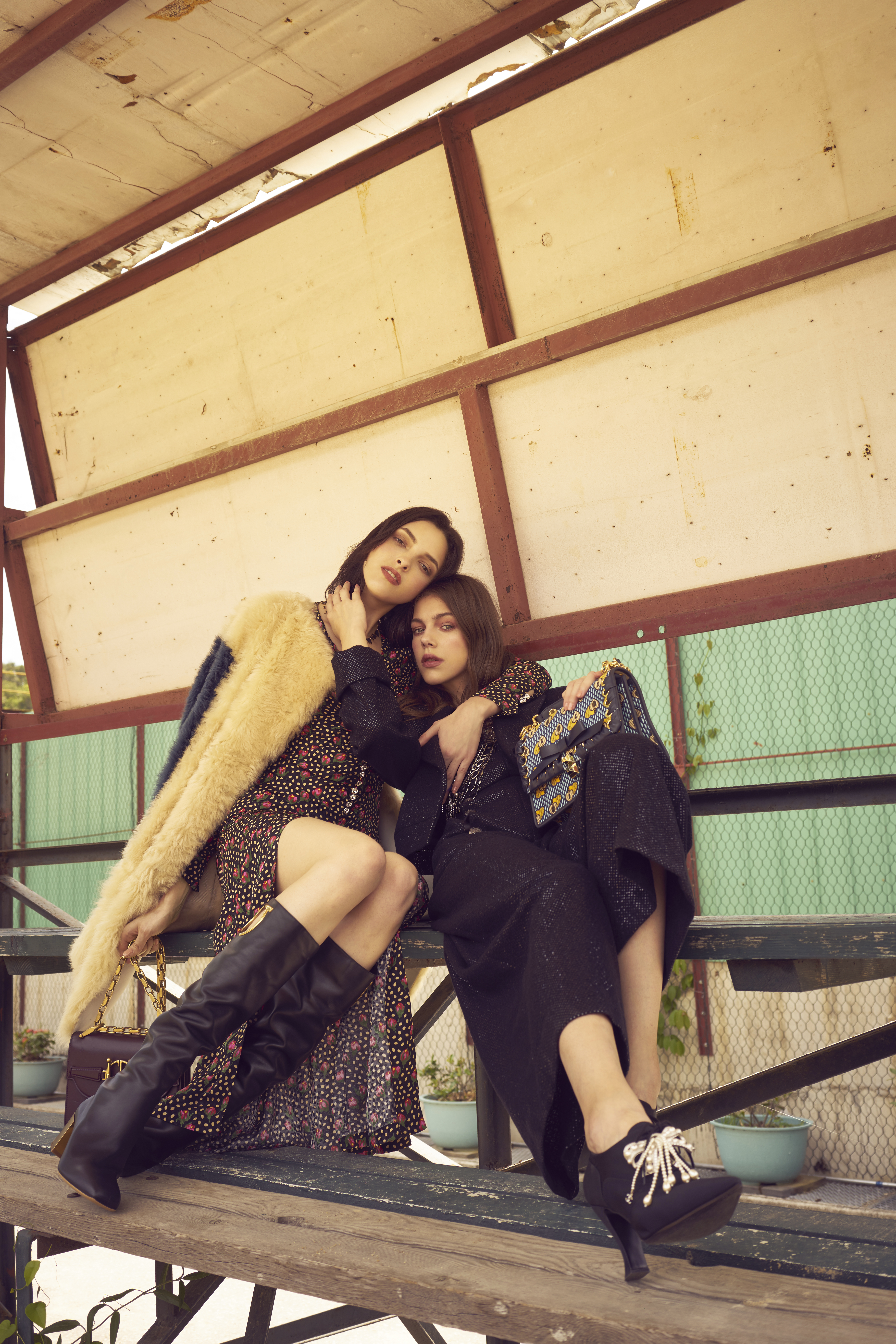 On Clarice (left): Dress_Miu Miu Coat_Bally Shoes_Salvatore Ferragamo Bag_Dior. On Amelia (right): Outfit_Chanel Bag_Fendi