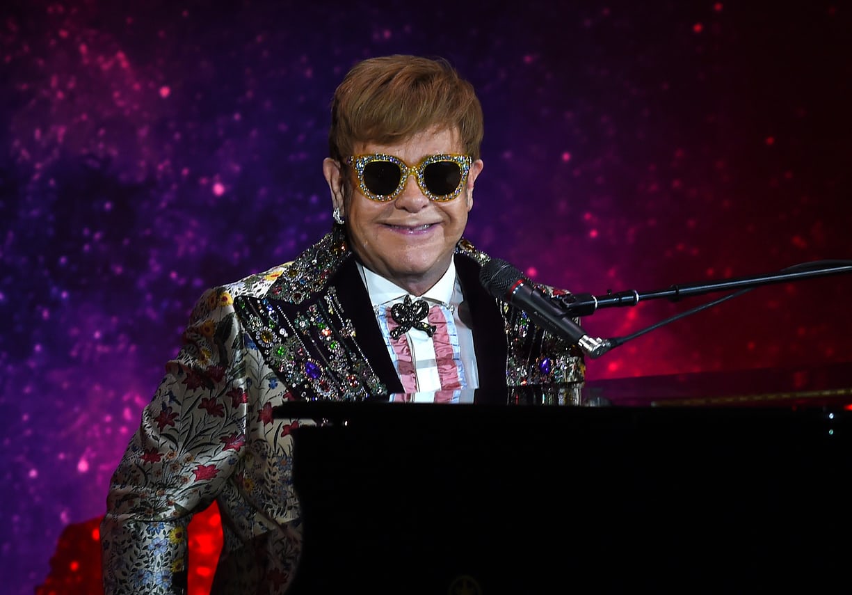 Elton John dressed in Gucci at the press conference for his farewell tour (Photo: Timothy A. Clary/AFP/Getty Images)