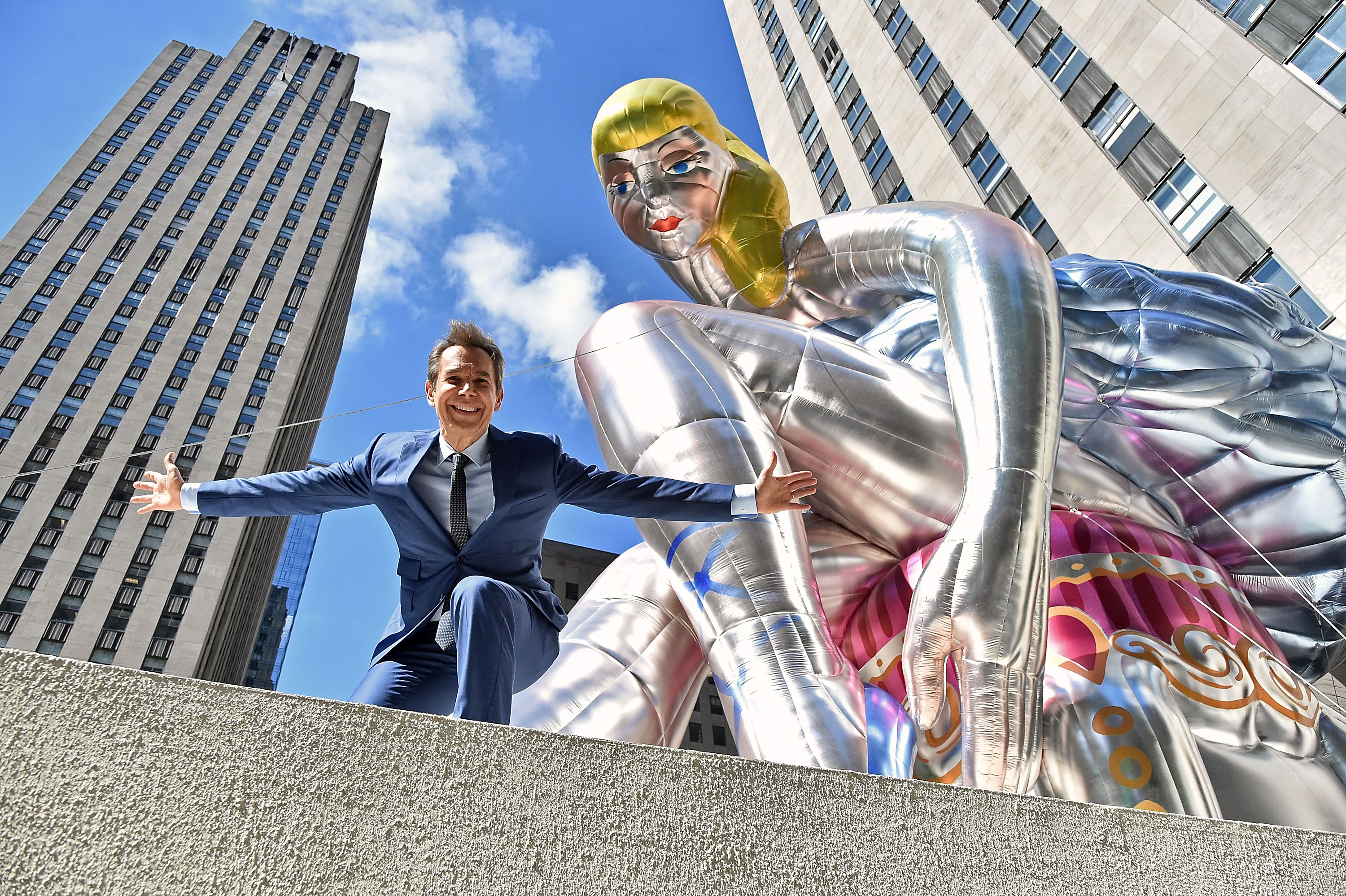 Jeff Koons with Seated Ballerina, a public art project at the Rockefeller Center in New York City.