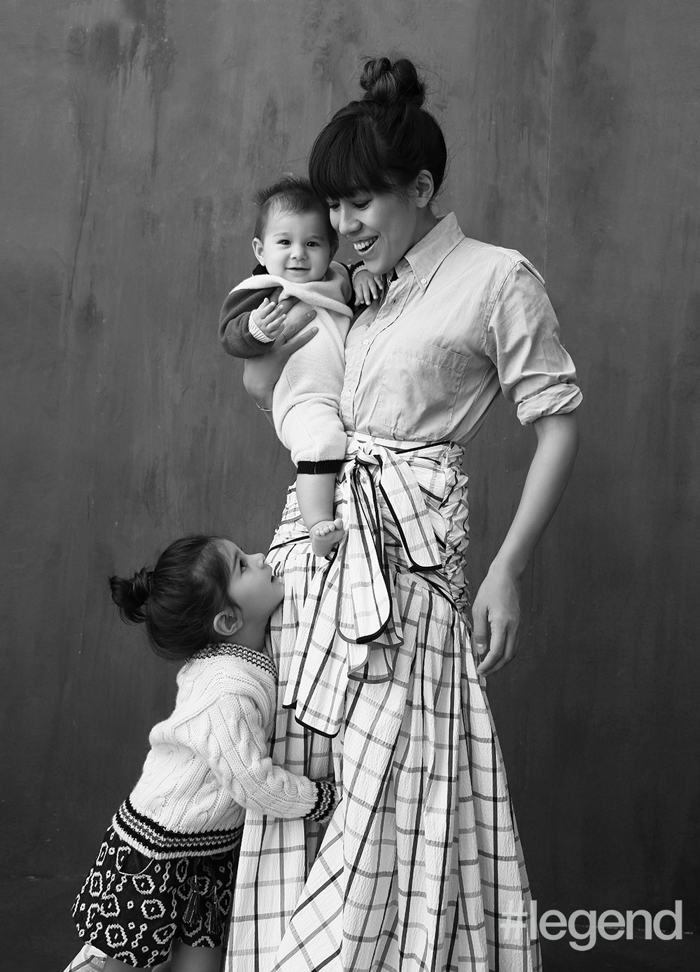 On Ingrid: Shirt by Them Browne and skirt by Rosie Assoulin from Joyce; On Hanaé: cashmere v-neck by Them Browne and shorts by Velveteen; On baby Kaïa: cashmere onesie by Them Browne