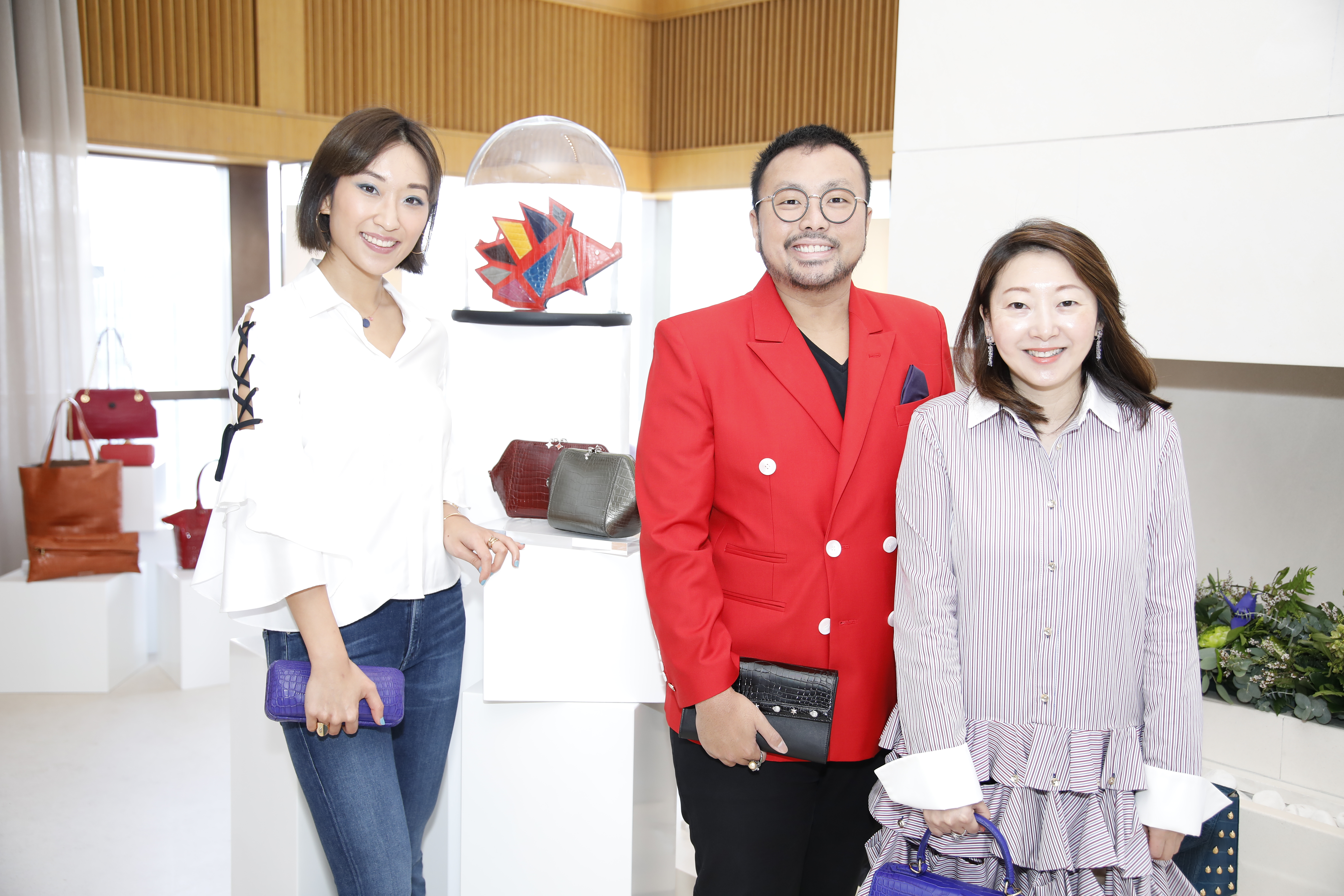 Jewellery designer Florence Tsai and accessories designer Ethan Koh with Winnie Chan