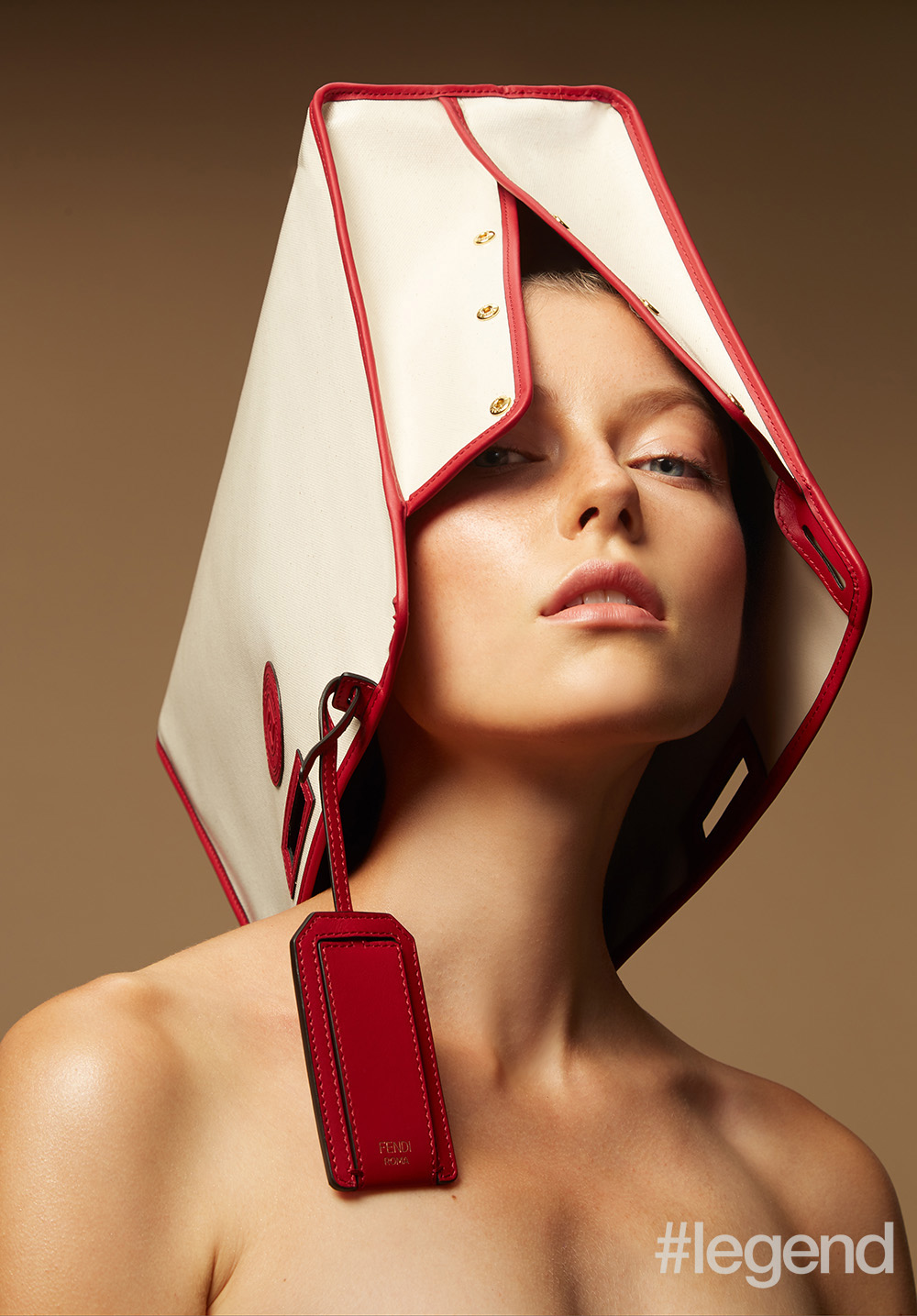 hite Peekaboo bag sleeve with red binding by Fendi