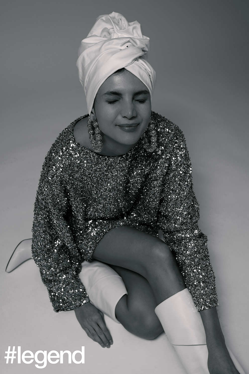 Silver sequinned mini dress_Isabel Marant; White slouchy boots_Givenchy; Silver oversized hoops earrings_Tom Ford; Turban stylist's own