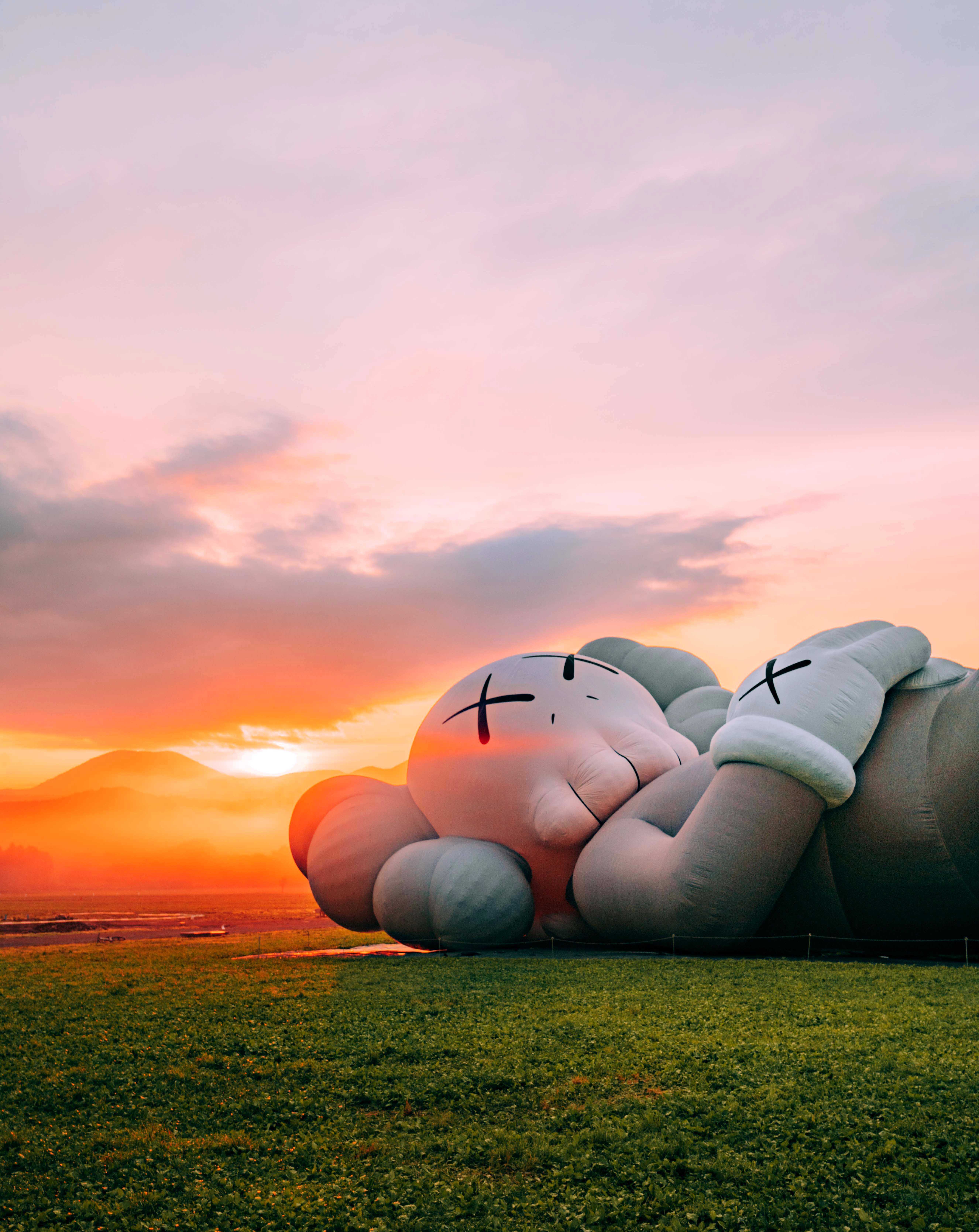 A stunning view of Mount Fuji with Kaws' Companion in the foreground