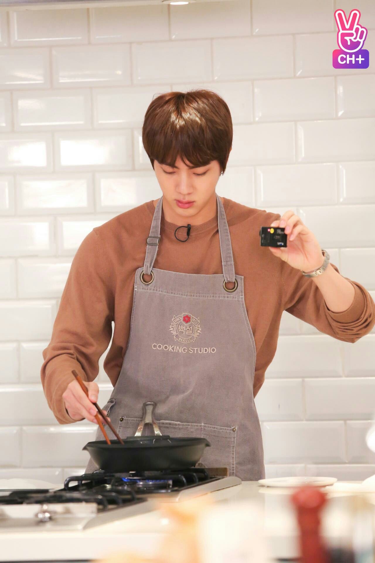 Jin cooks up a storm; photo: V Live