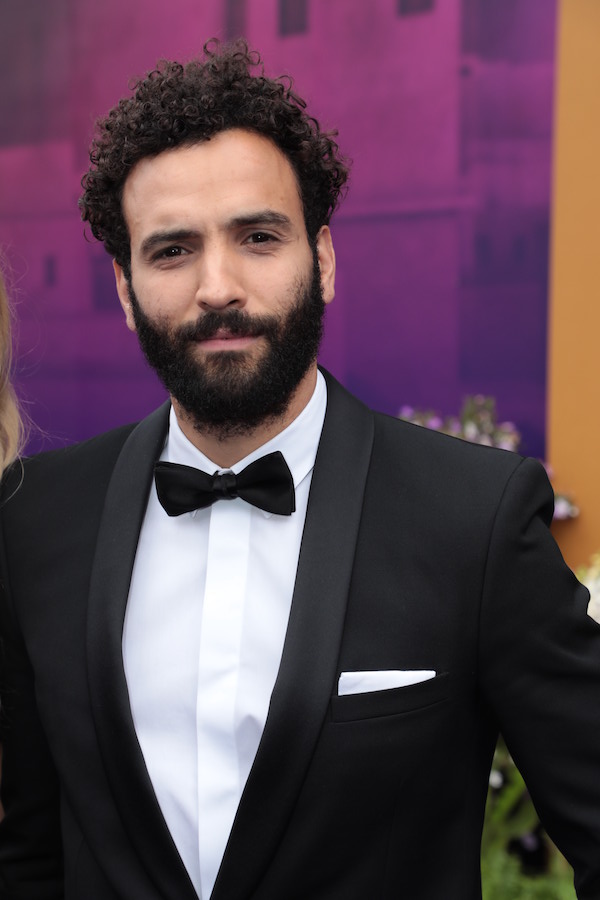 Marwan Kenzari sports a classic black tux at the Aladdin L.A. premiere. Photo: Courtesy of Disney