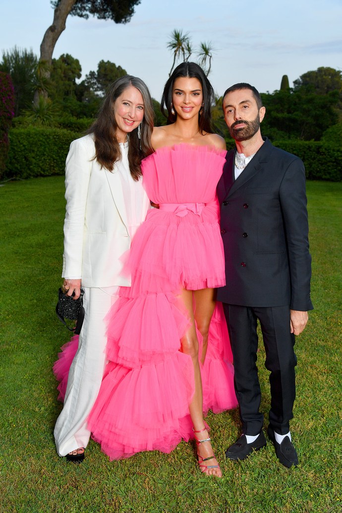 Kendall Jenner posing with Giambattista Valli and Ann-Sofie Johansson in a hot pink layered frock.