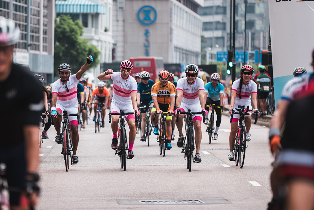 Fabrice Weber (second from left) and colleagues at ELC continue to raise awareness with pink and white jerseys at Hong Kong's most recent cyclathon. 