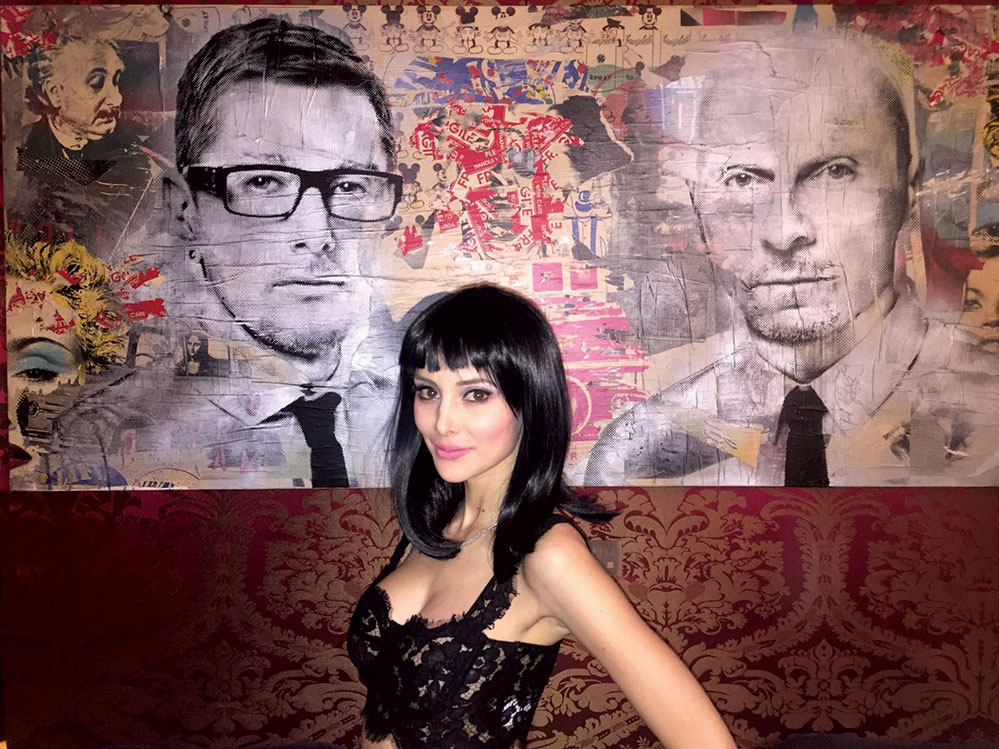 Posing in front of a mural at the Dolce & Gabbana show in Milan