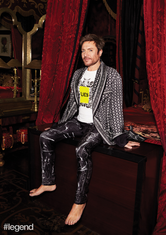 Simon wears robe and pyjama trousers by Dolce & Gabbana