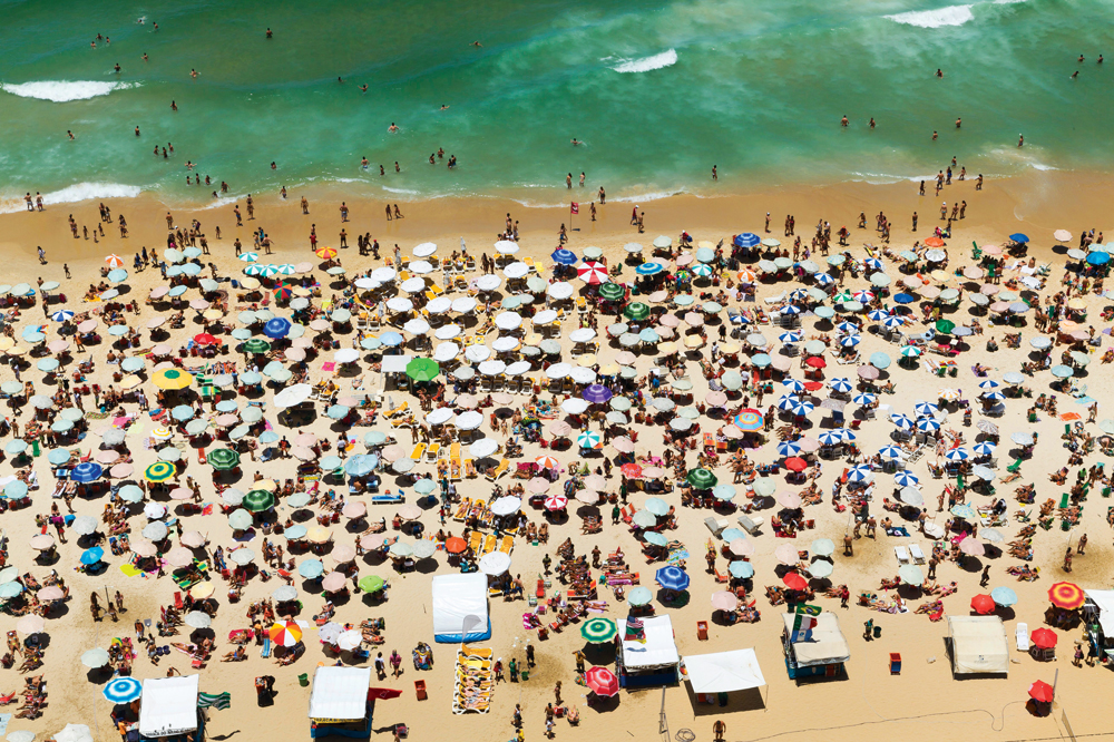 In Rio, everything under the sun takes place on Ipanema Beach (Credit: Corbis/Imaginechina)