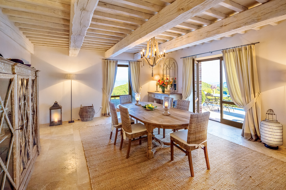 The dining room exudes a countryside calmness at Villa Santa Croce