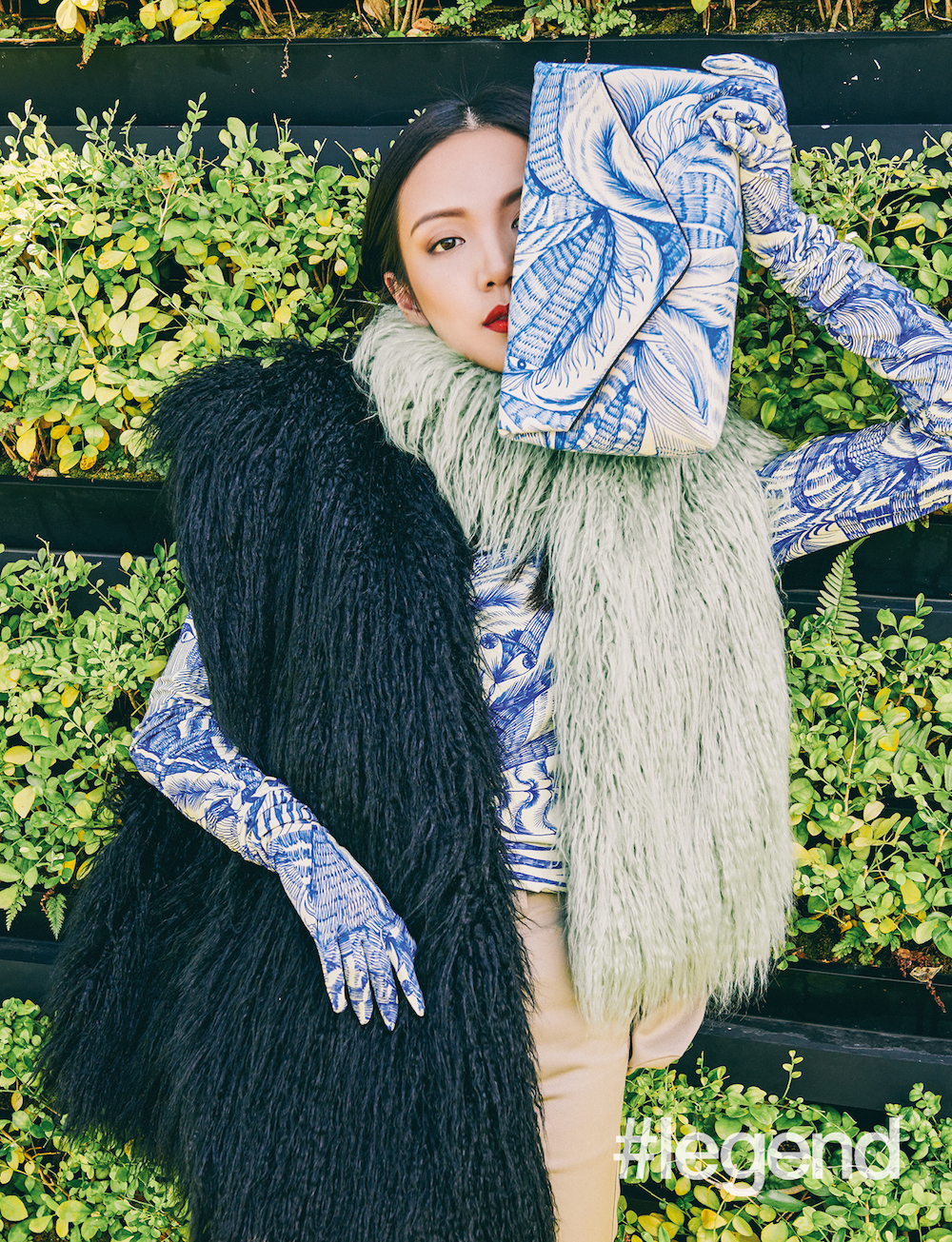 Blue and white printed turtleneck, printed gloves, black and pistachio faux-fur stole and printed canvas clutch _ Dries Van Noten, by Joyce; Khaki skinny cargo pants _ Marine Serre, by Joyce