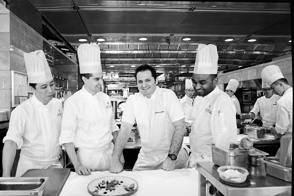 Chef Guillaume Galliot surrounded by his team