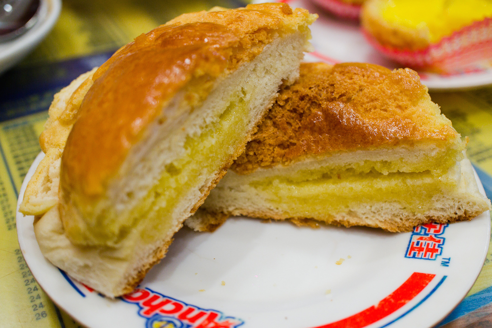 Kam Wah cafe serves their pineapple buns with a slab of butter (Photo: That food cray)