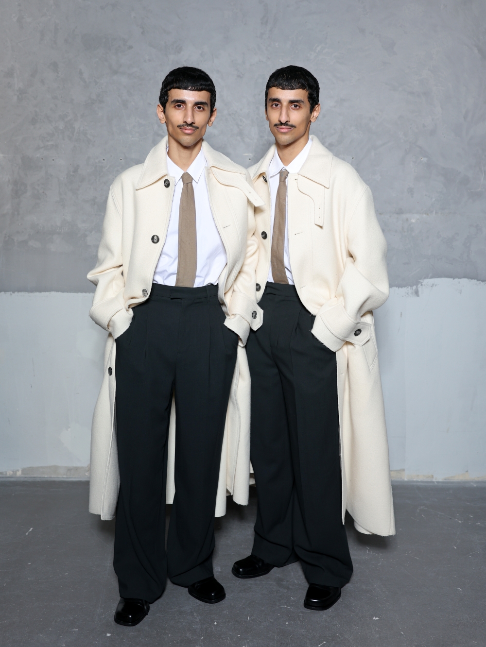 PARIS, FRANCE - JANUARY 21: Mohammad Hadban and Humaid Hadban attend the Ami Paris Menswear Fall/Winter 2026-2027 show as part of Paris Fashion Week on January 21, 2026 in Paris, France. (Photo by Arnold Jerocki/Getty Images for Ami Paris)