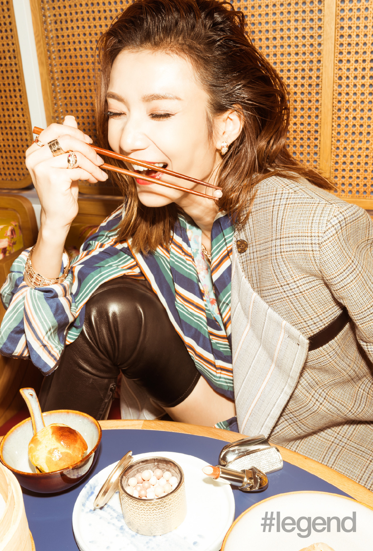 Grace Wong eating dumplings with chopsticks