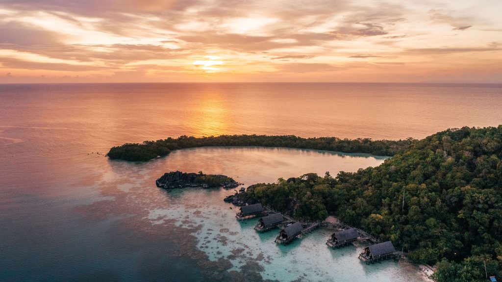 aerial_overwater_suite_sunset_with_setigi_reef_background-min