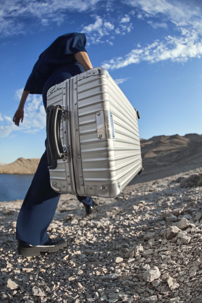 RIMOWA And Palace Team Up To Produce The Original Cabin Desert Suitcase And  Skateboard Deck - IMBOLDN