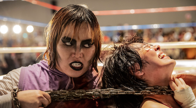 Dump Matsumoto chokes rival Chigusa Nagano with a chain.