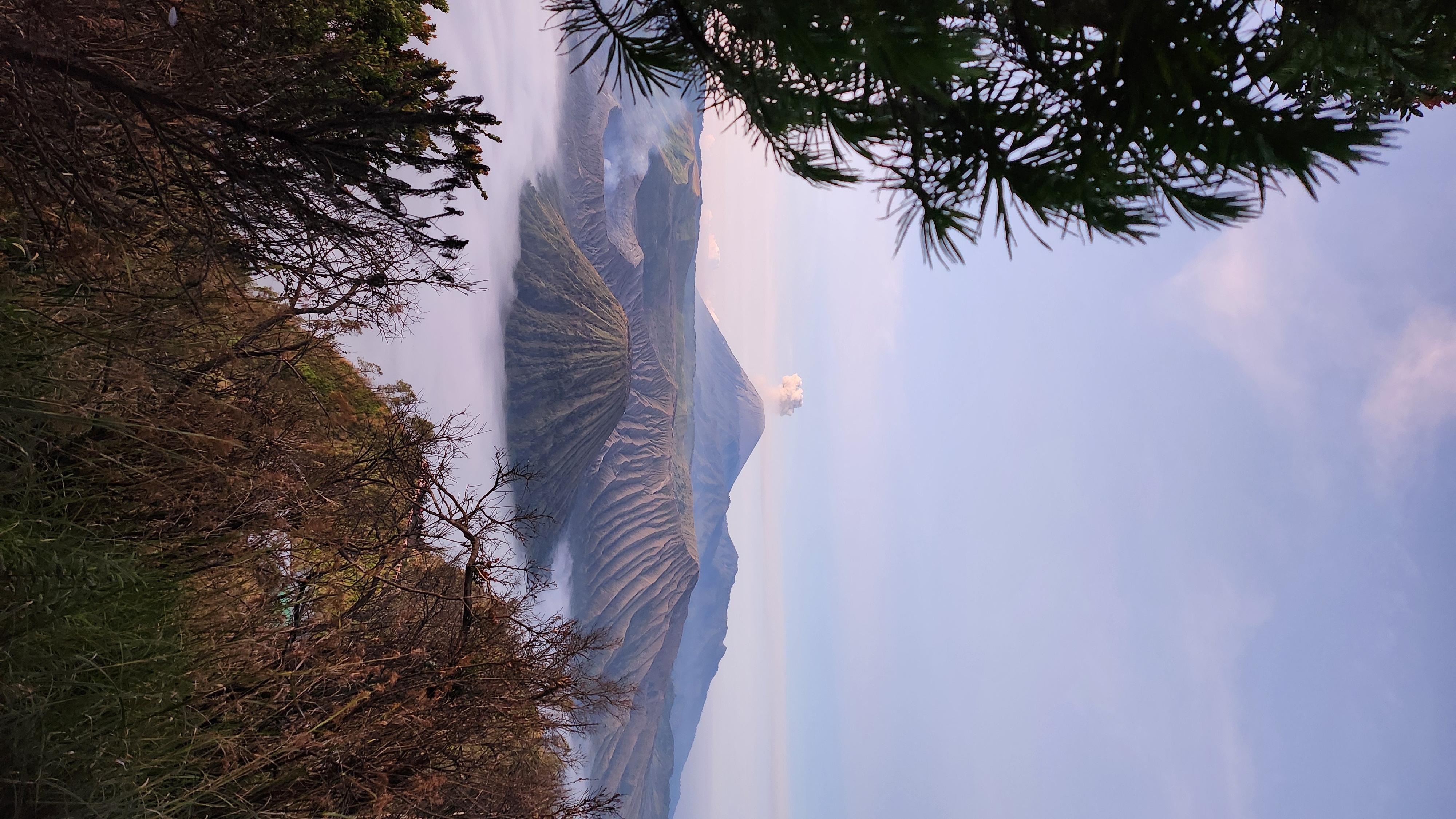The Standard Chartered Smartphone Weather Photographer of the Year Winner is Nur Syaireen Natasya Binti Azaharin of Selangor, Malaysia, who had gone out with the expectation of capturing a sunrise but was instead rewarded with this glorious view of smoking volcanoes in East Java, Indonesia.