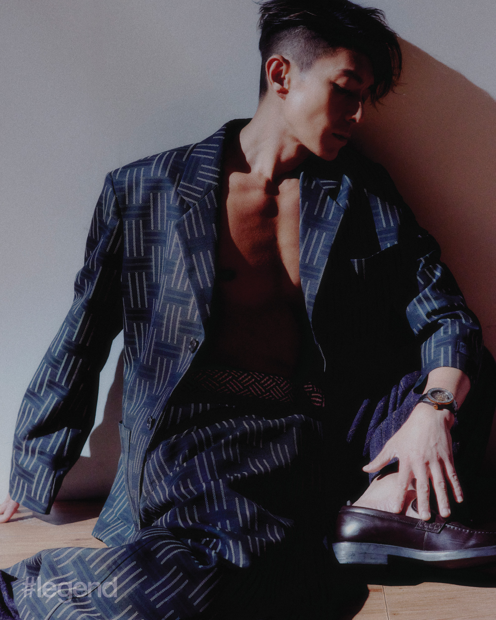 Navy printed blazer, trousers and kilt _ Kenzo; Captain Cook High-Tech Ceramic Skeleton _ Rado (Stylist’s own shoes)