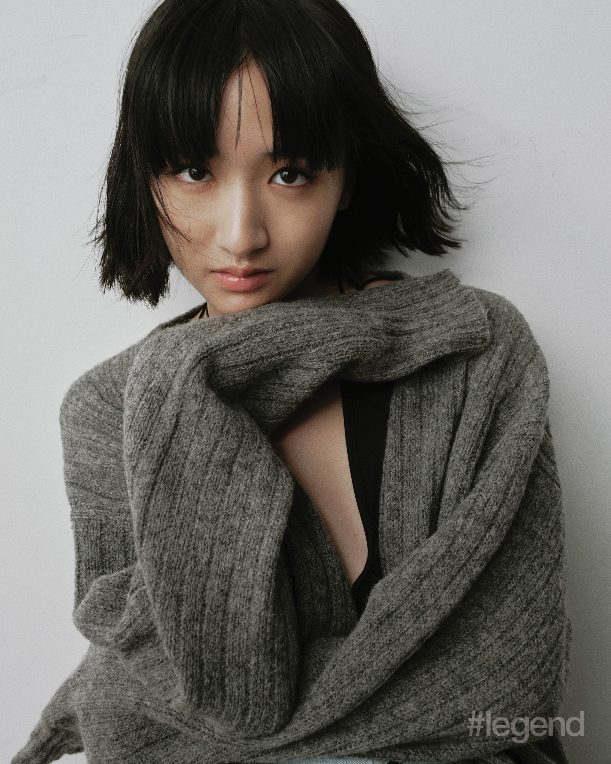 Grey knit cardigan _ Miu Miu Black bodysuit _ Gil Rodriguez