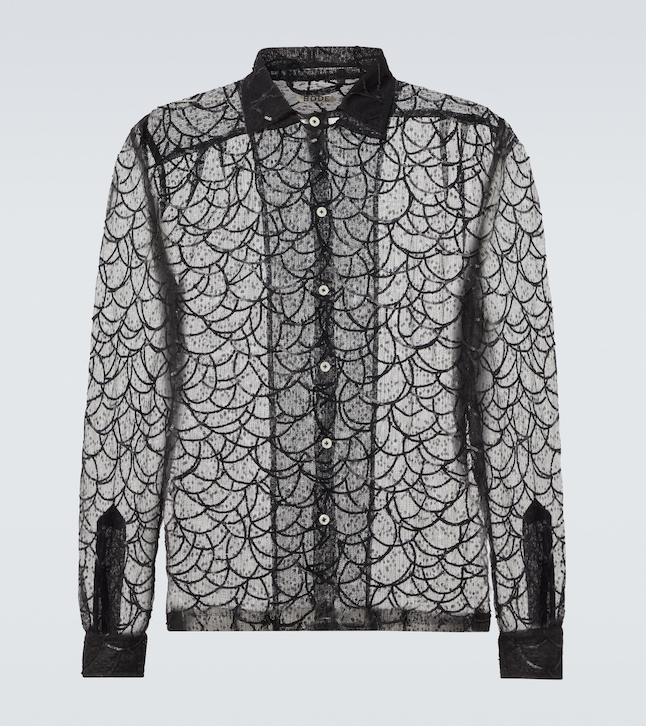 Black sequin mesh shirt _ Bode; Blue straight-leg jeans _ McQueen from Mr Porter; Black loafers _ Christian Louboutin; White floral printed shirt _ Louis Vuitton