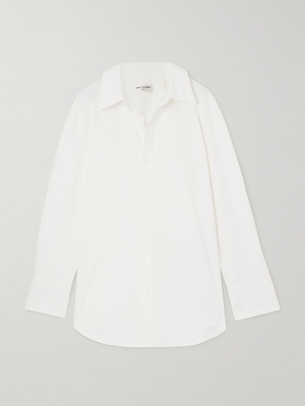 White cotton poplin shirt _ Saint Laurent; Blue ruffled tweed jacket _ Valentino Garavani from Net-A-Porter; Blue asymmetric straight-leg jeans _ Loewe; Light blue FF velvet pouch _ Fendi; White leather ballet flats _ Chloé