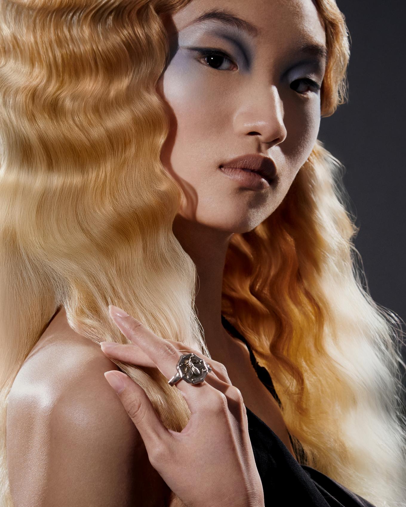 Bee ring _ Dior; Black dress _ Louis Vuitton